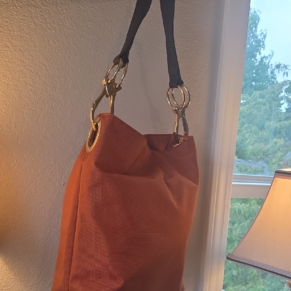 Chic Orange Shoulder Bag with Black Straps